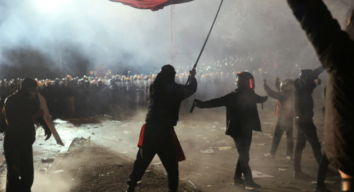 Turkish police face demonstrators in Istanbul during clashes after opposition arrest